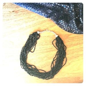 Black multi strand bead necklace